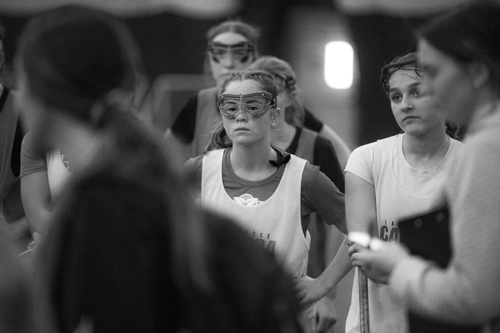 Canadian National Development team athletes listen to their coach instruct